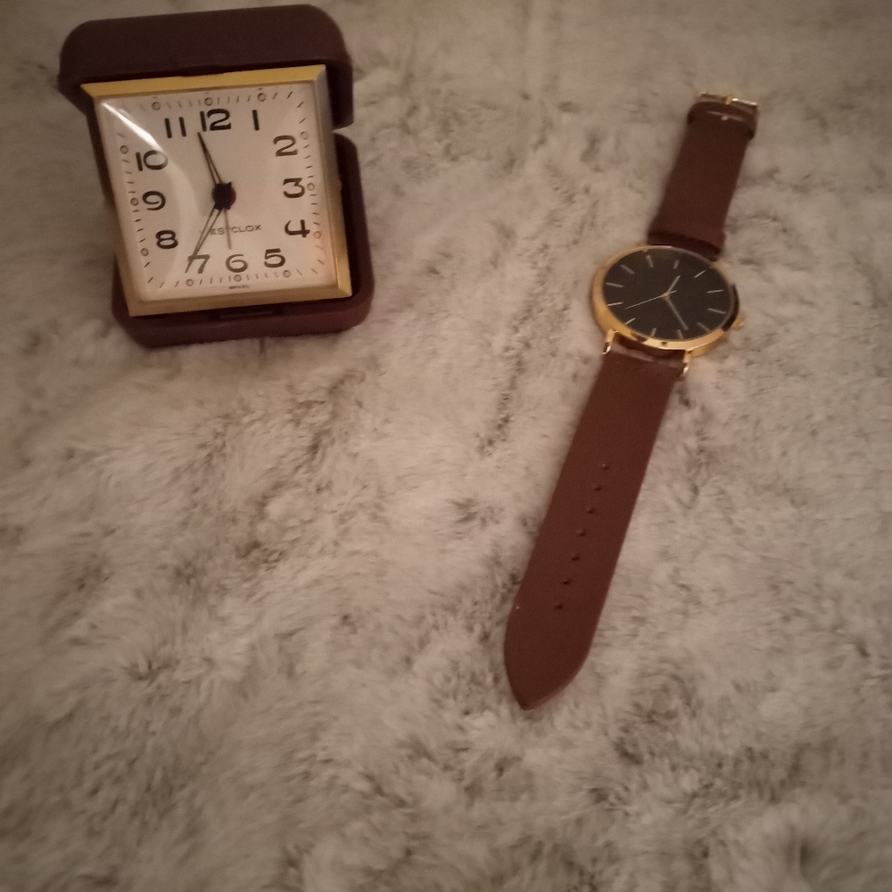 Dressy men's large crown rose gold bezel watch with navy metallic face and brown